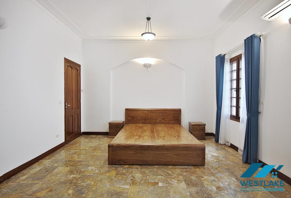 Lovely 04 bedrooms house with big yard for rent in To ngoc Van, Tay Ho, Ha Noi