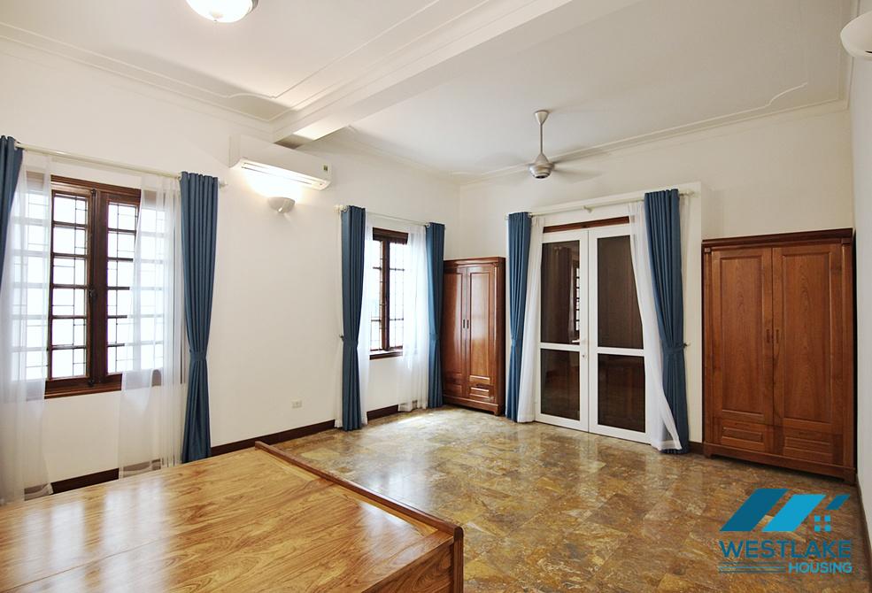 Lovely 04 bedrooms house with big yard for rent in To ngoc Van, Tay Ho, Ha Noi