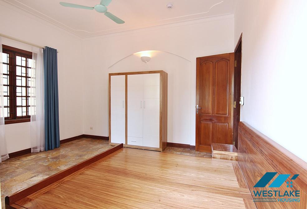 Lovely 04 bedrooms house with big yard for rent in To ngoc Van, Tay Ho, Ha Noi