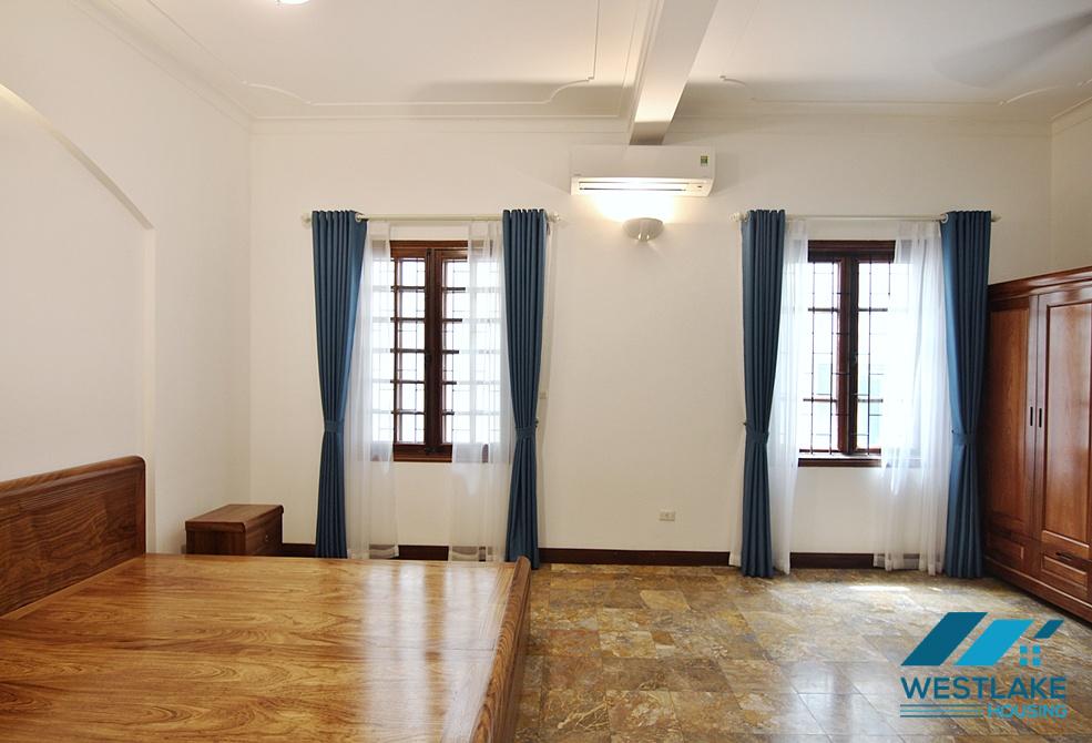 Lovely 04 bedrooms house with big yard for rent in To ngoc Van, Tay Ho, Ha Noi