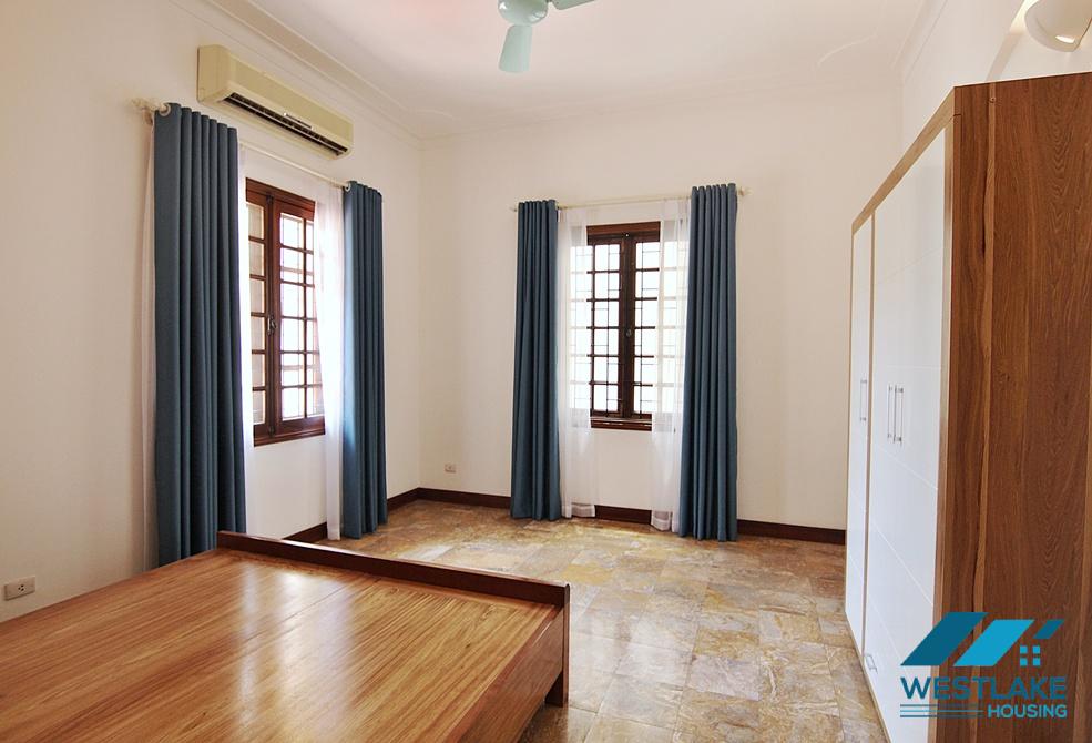 Lovely 04 bedrooms house with big yard for rent in To ngoc Van, Tay Ho, Ha Noi