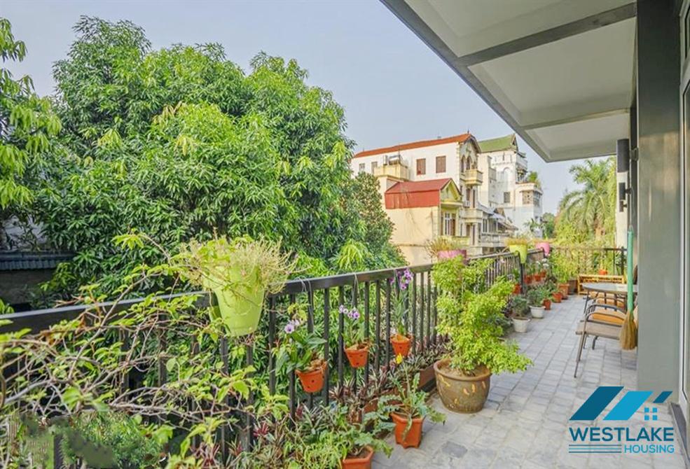 A green and airy four bedrooms apartment for rent in Au Co street, Tay Ho, Ha Noi